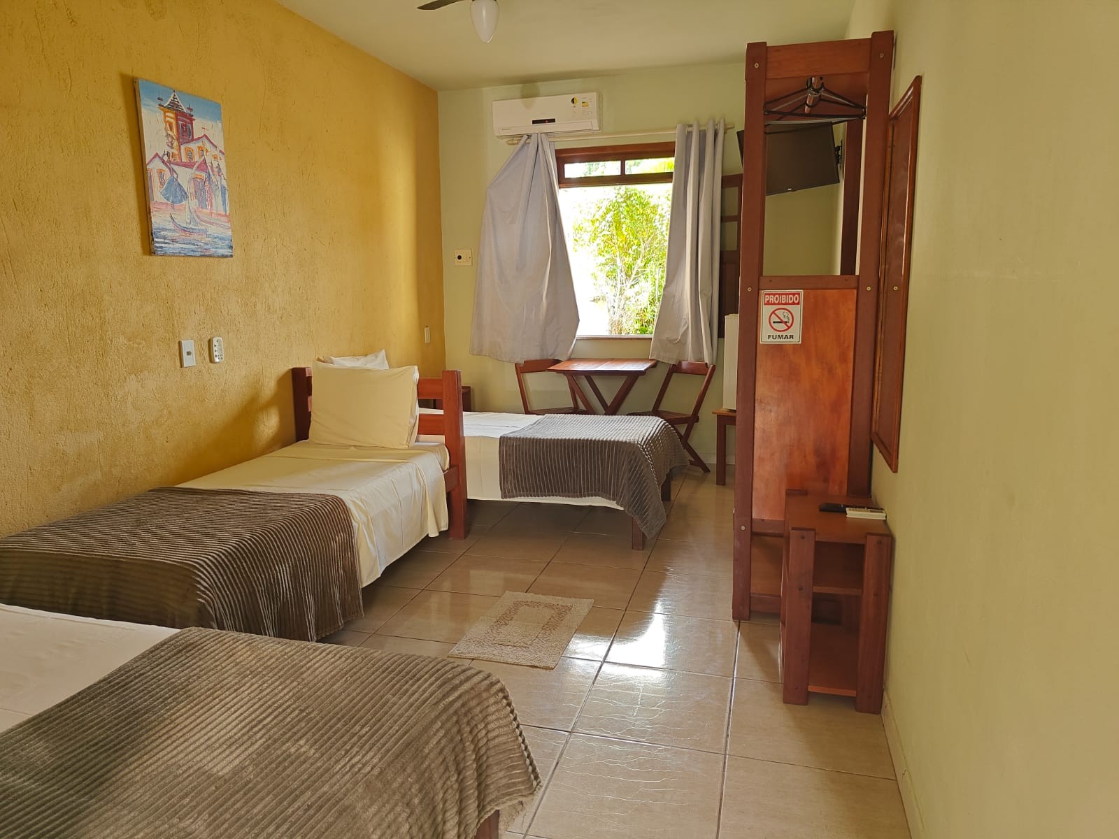 Apartamento triplo com TV e ar-condicionado